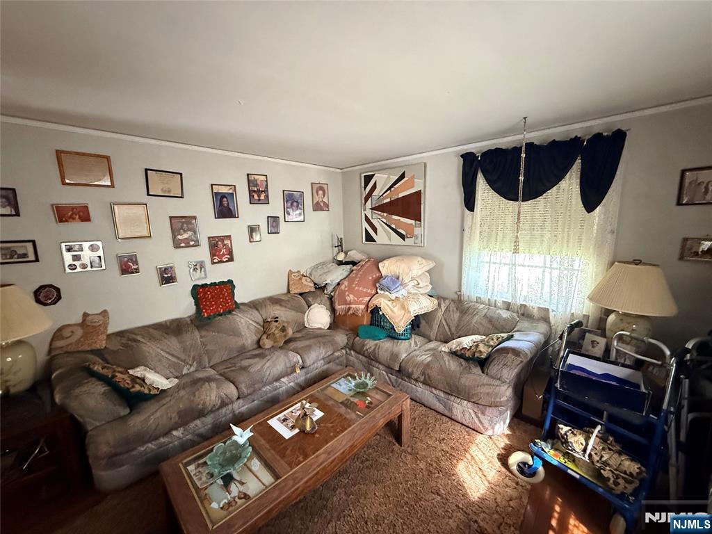 599 South Center Street Orange, NJ 07050 - Photo 9 of 19 a living room with furniture and a window