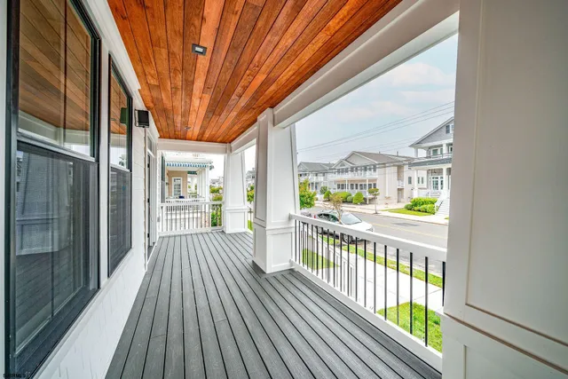 a view of balcony with wooden floor