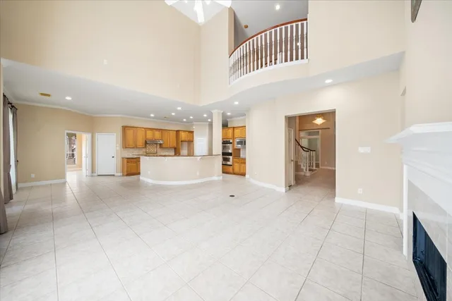 a view of a hallway with a furniture and a kitchen