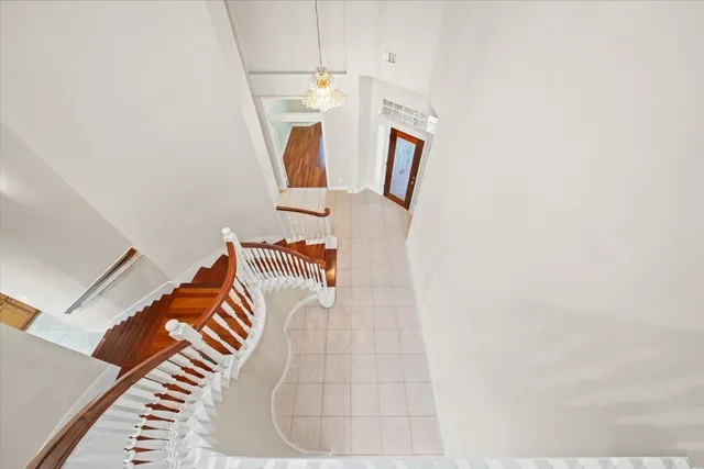 a room with wooden floor and white walls