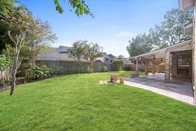 a view of a backyard with a sitting area