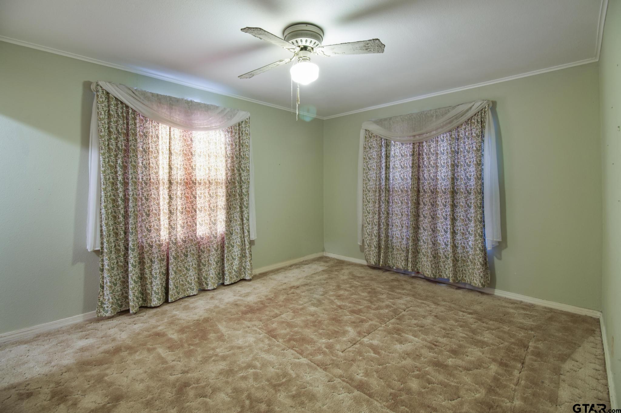 1919 East Ferdell Street Tyler, TX 75701 - Photo 16 of 24 a view of an empty room with a window