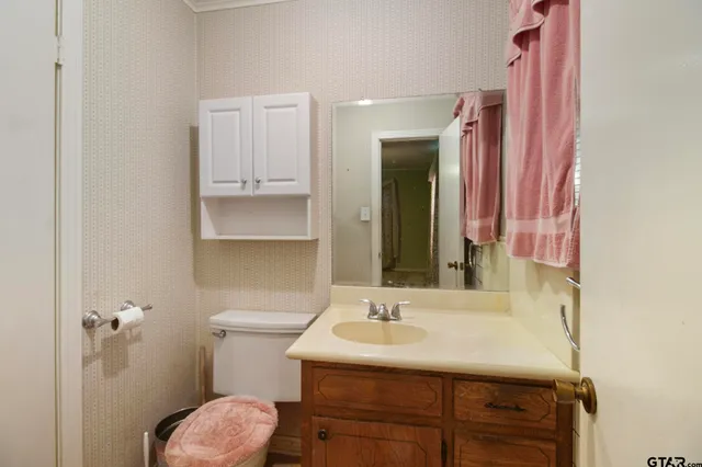 a bathroom with a shower and a sink