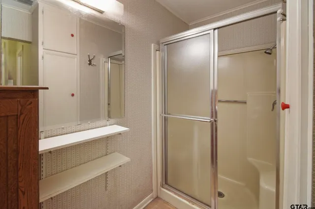 a view of an empty room with closet area