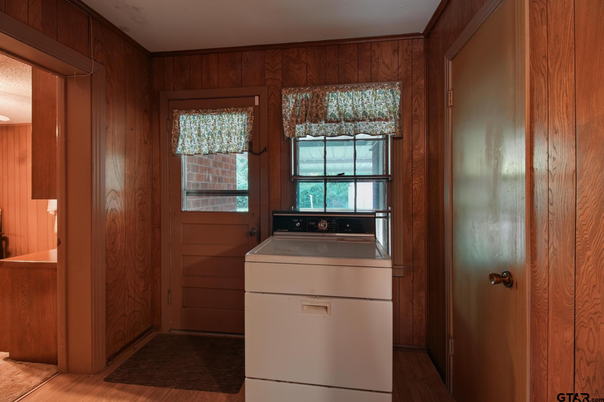 1919 East Ferdell Street Tyler, TX 75701 - Photo 20 of 24 a room with dryer and washer