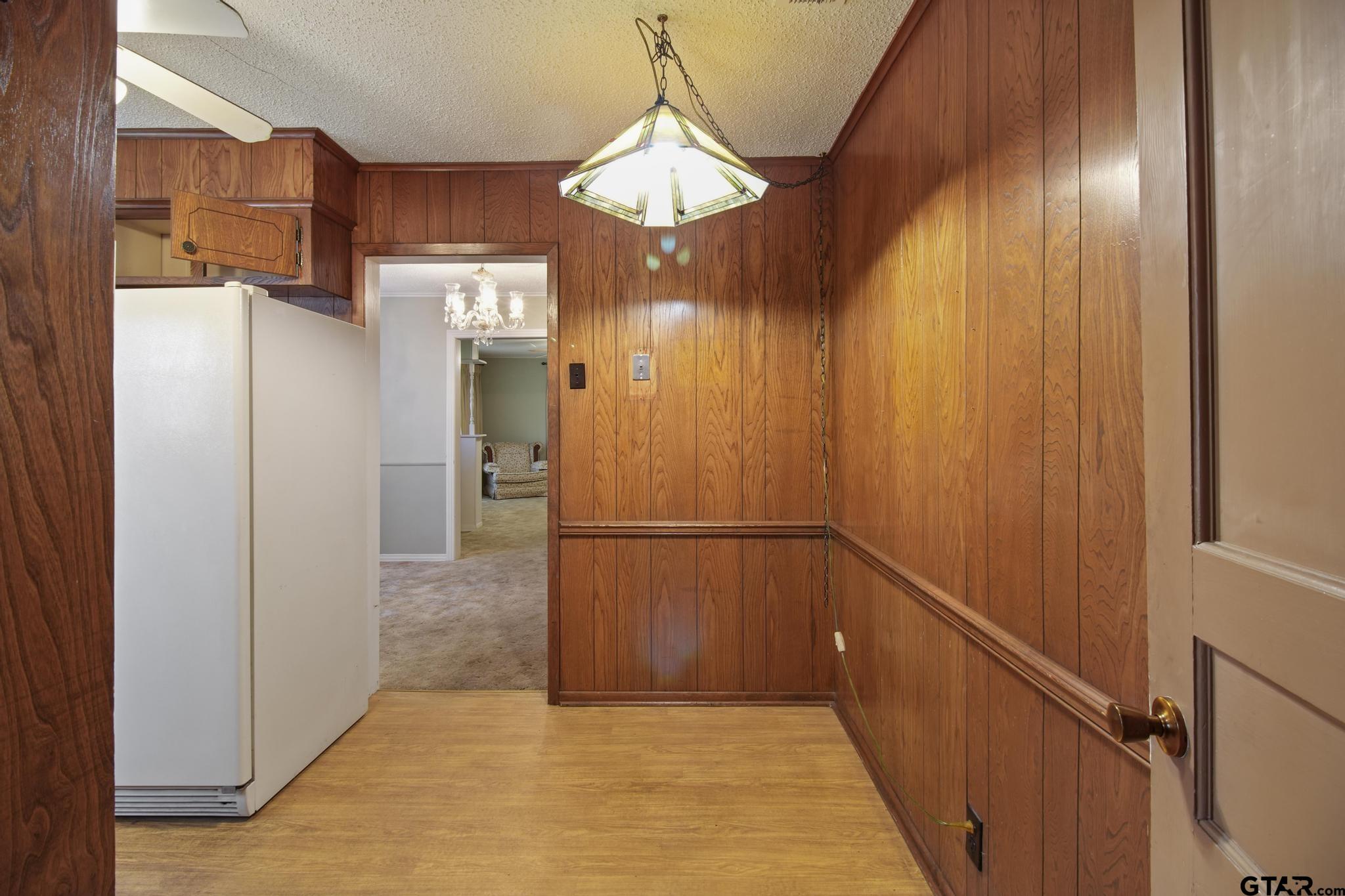 1919 East Ferdell Street Tyler, TX 75701 - Photo 21 of 24 a view of a hallway with wooden cabinets