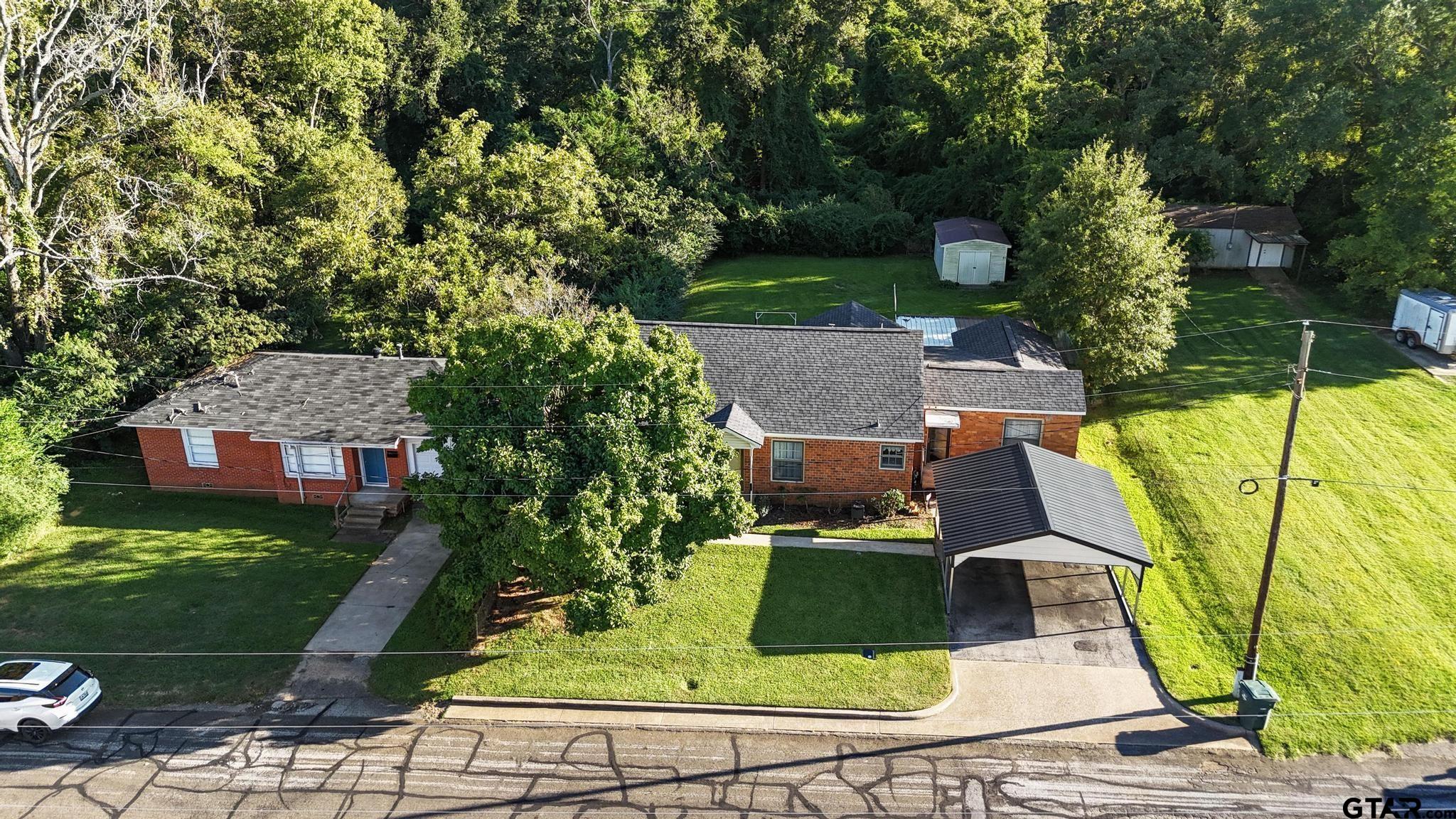 1919 East Ferdell Street Tyler, TX 75701 - Photo 5 of 24 an aerial view of a house with swimming pool garden and patio