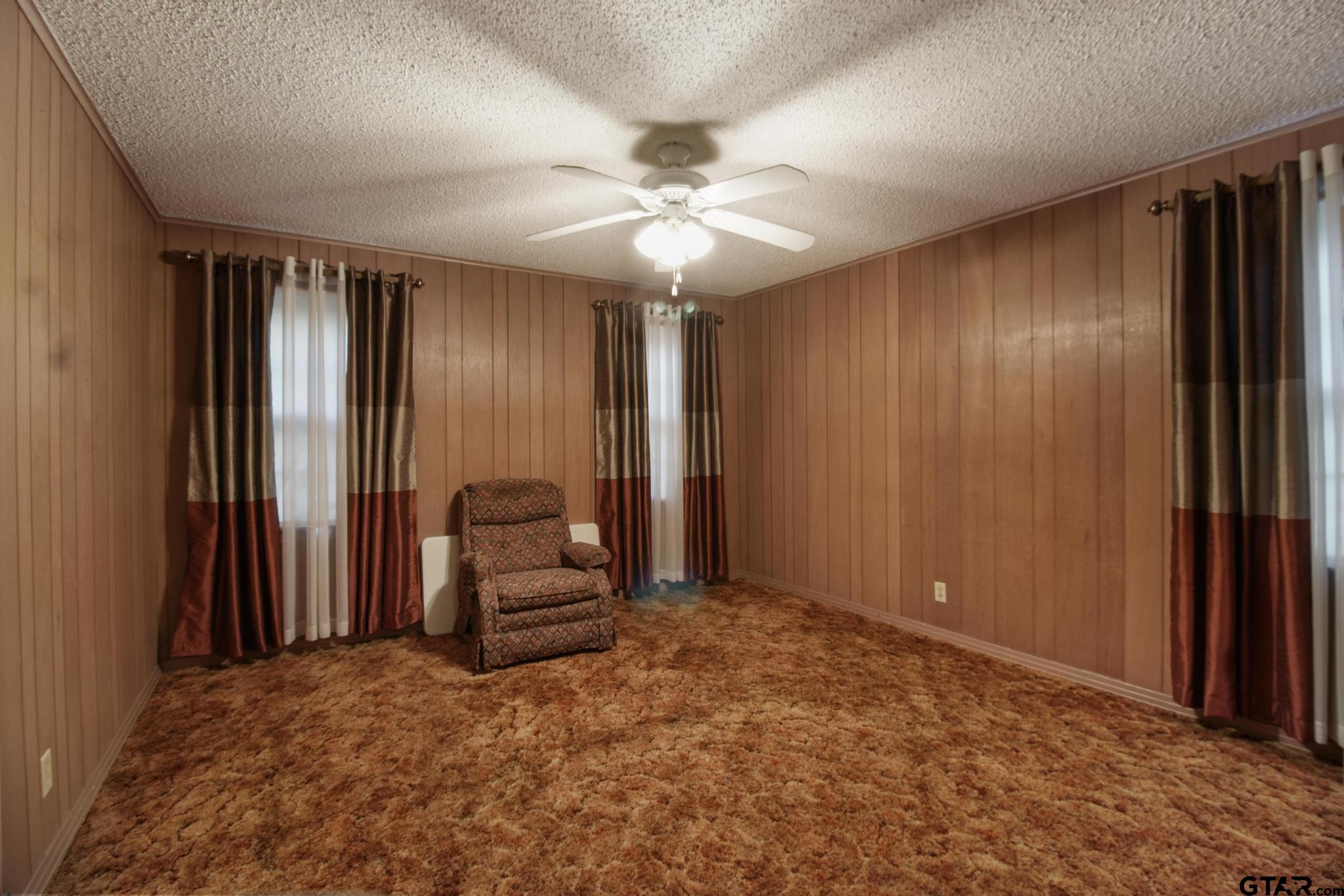 1919 East Ferdell Street Tyler, TX 75701 - Photo 7 of 24 wooden floor and windows in a room