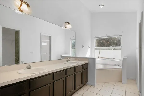 a bathroom with a sink a vanity and a mirror
