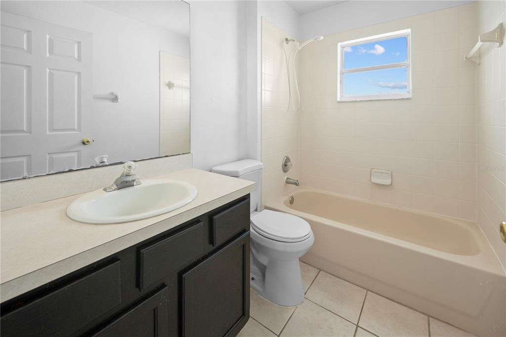 11748 Constance Way Clermont, FL 34711 - Photo 21 of 45 a bathroom with a sink and a mirror