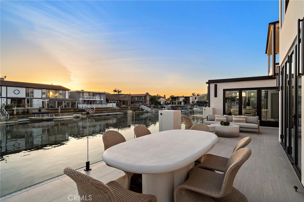 16471 Barnstable Circle Huntington Beach, CA 92649 - Photo 28 of 57 a patio with patio a couch and chairs