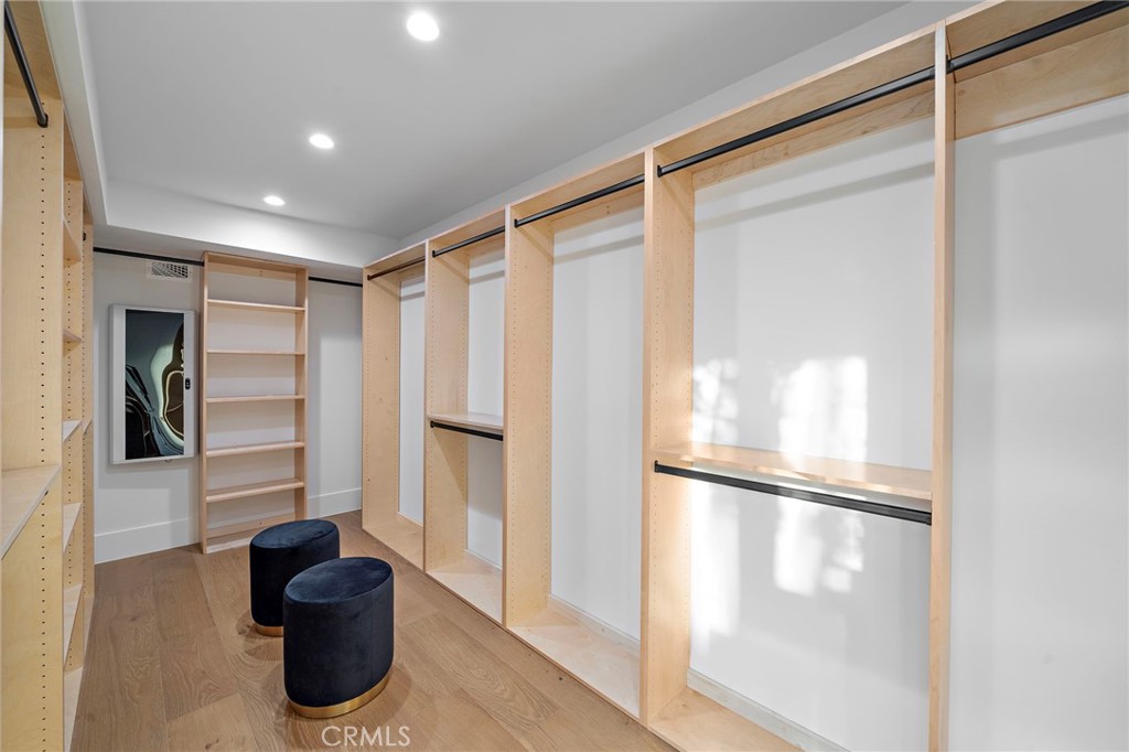 16471 Barnstable Circle Huntington Beach, CA 92649 - Photo 36 of 57 a view of empty room with wooden floor and cabinet