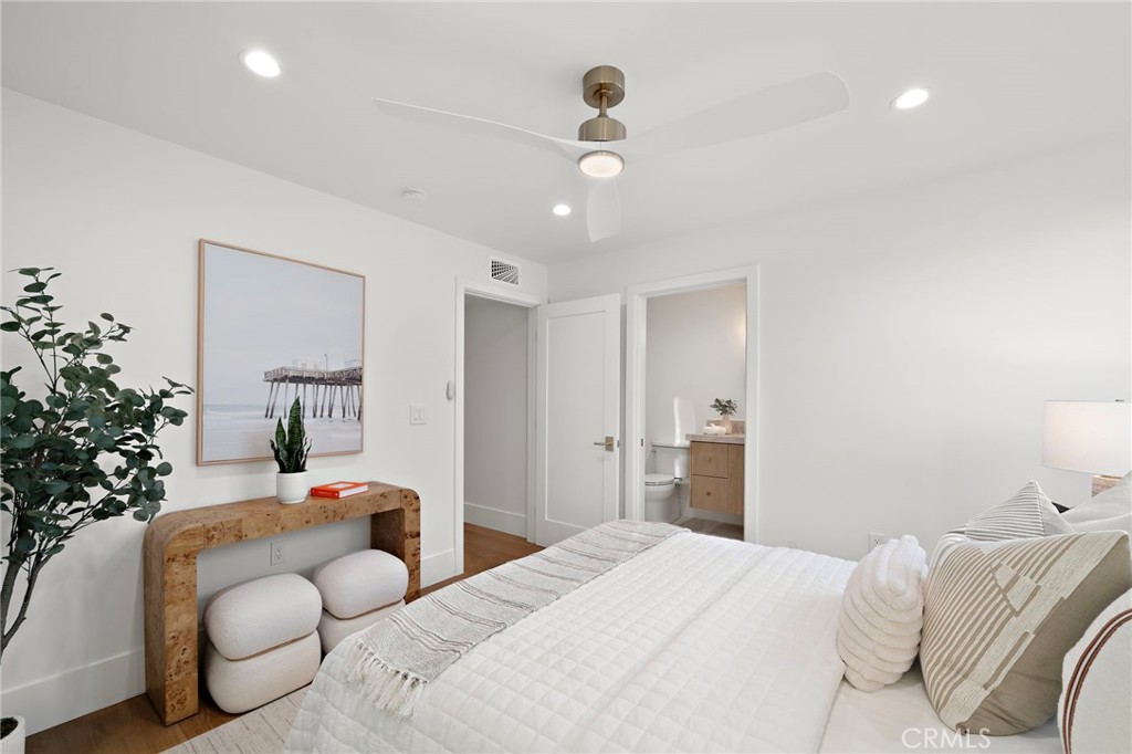 16471 Barnstable Circle Huntington Beach, CA 92649 - Photo 47 of 57 a bedroom with a bed and ceiling fan