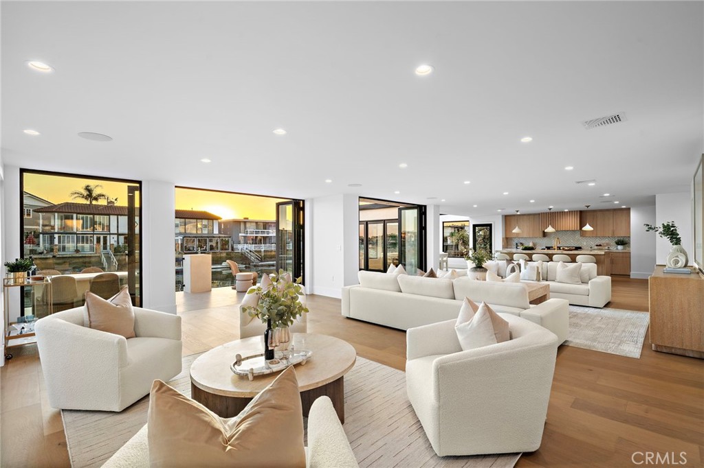 16471 Barnstable Circle Huntington Beach, CA 92649 - Photo 5 of 57 a living room with fireplace furniture and a large window