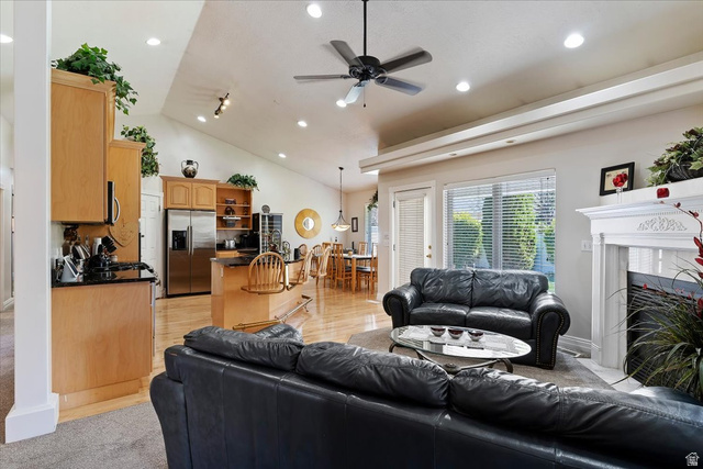 1924 North 2000th Street East Layton, UT 84040 - Photo 14 of 41 Living area featuring ceiling fan, recessed lighting, a fireplace, and vaulted ceiling