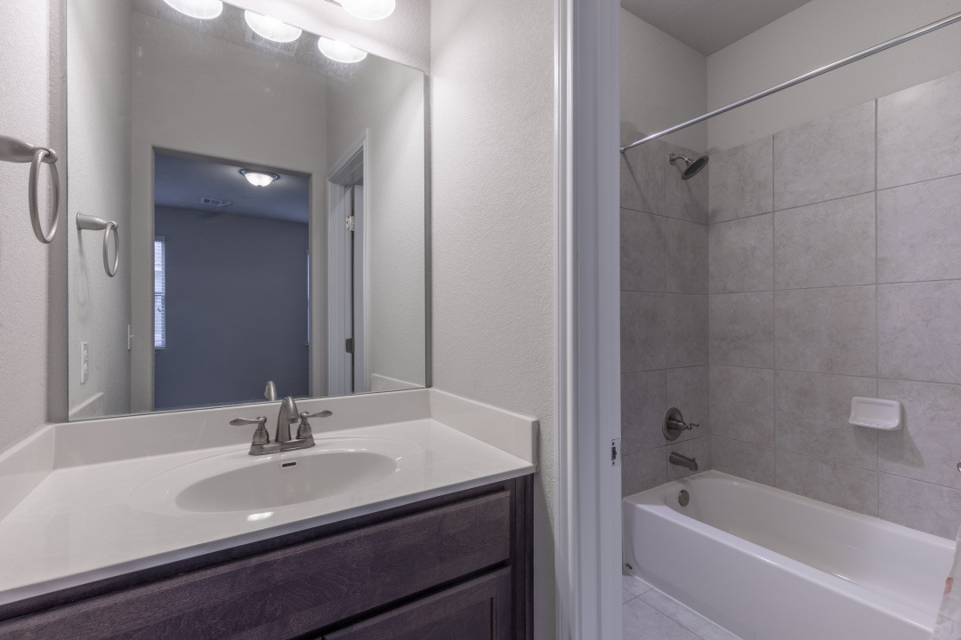 14904 Cabrillo Way Austin, TX 78738 - Photo 11 of 20 a bathroom with a bath tub sink and mirror