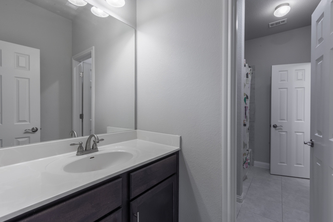 14904 Cabrillo Way Austin, TX 78738 - Photo 10 of 20 a bathroom with a sink and a mirror