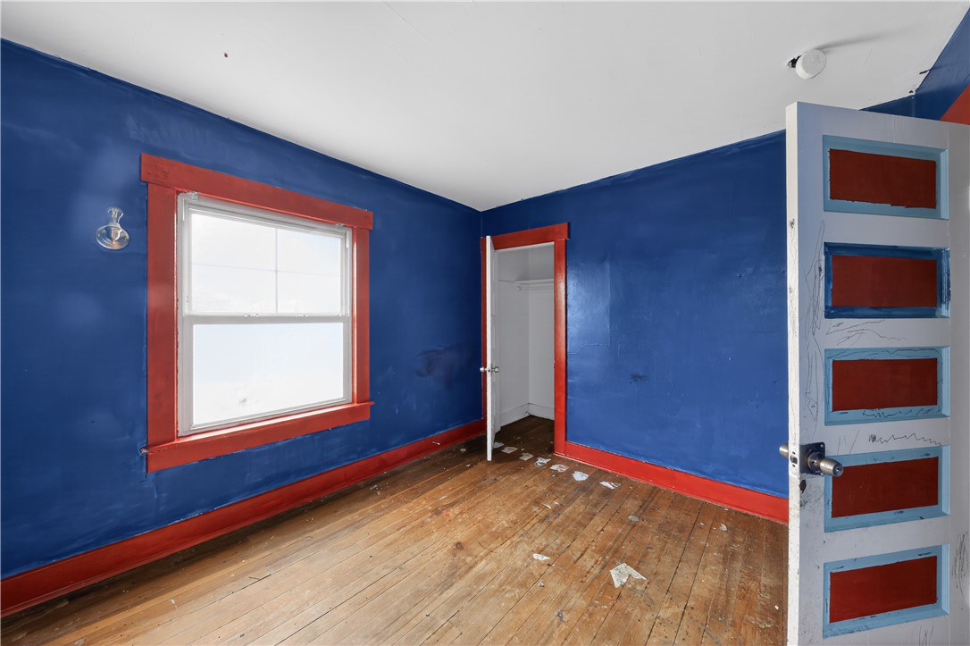 205 Rita Street Dayton, OH 45404 - Photo 12 of 34 This spacious room features hardwood floors and ample natural light, creating a bright and inviting atmosphere.