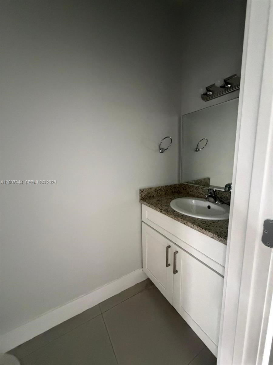 381 East 50th Street, Unit 6 Hialeah, FL 33013 - Photo 13 of 37 a kitchen with a sink and cabinets