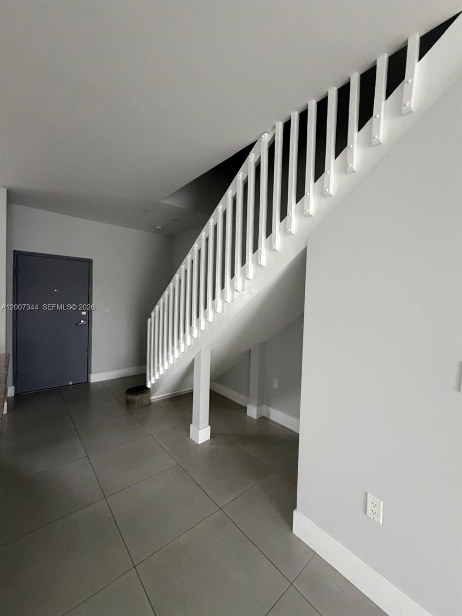381 East 50th Street, Unit 6 Hialeah, FL 33013 - Photo 15 of 37 a view of entryway with stairs