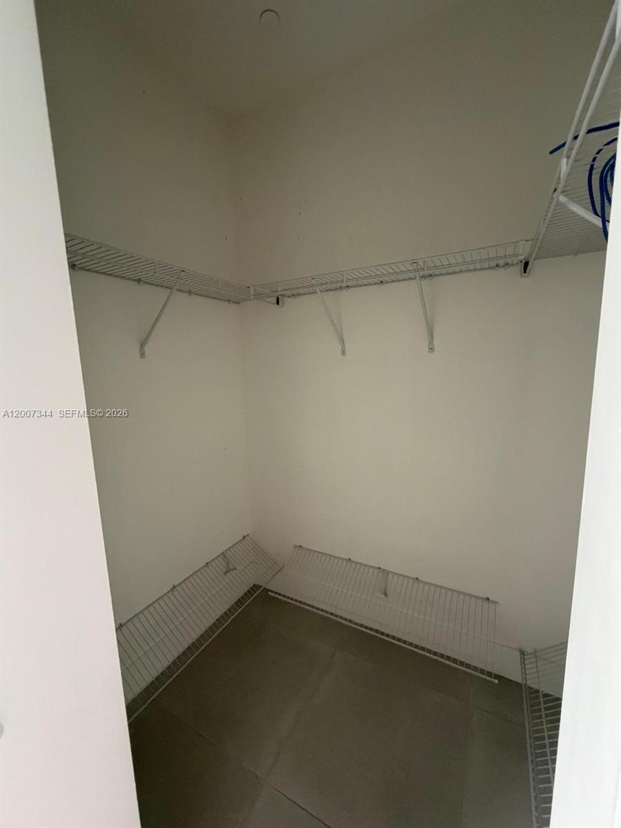 381 East 50th Street, Unit 6 Hialeah, FL 33013 - Photo 25 of 37 a view of a room with racks on the wall