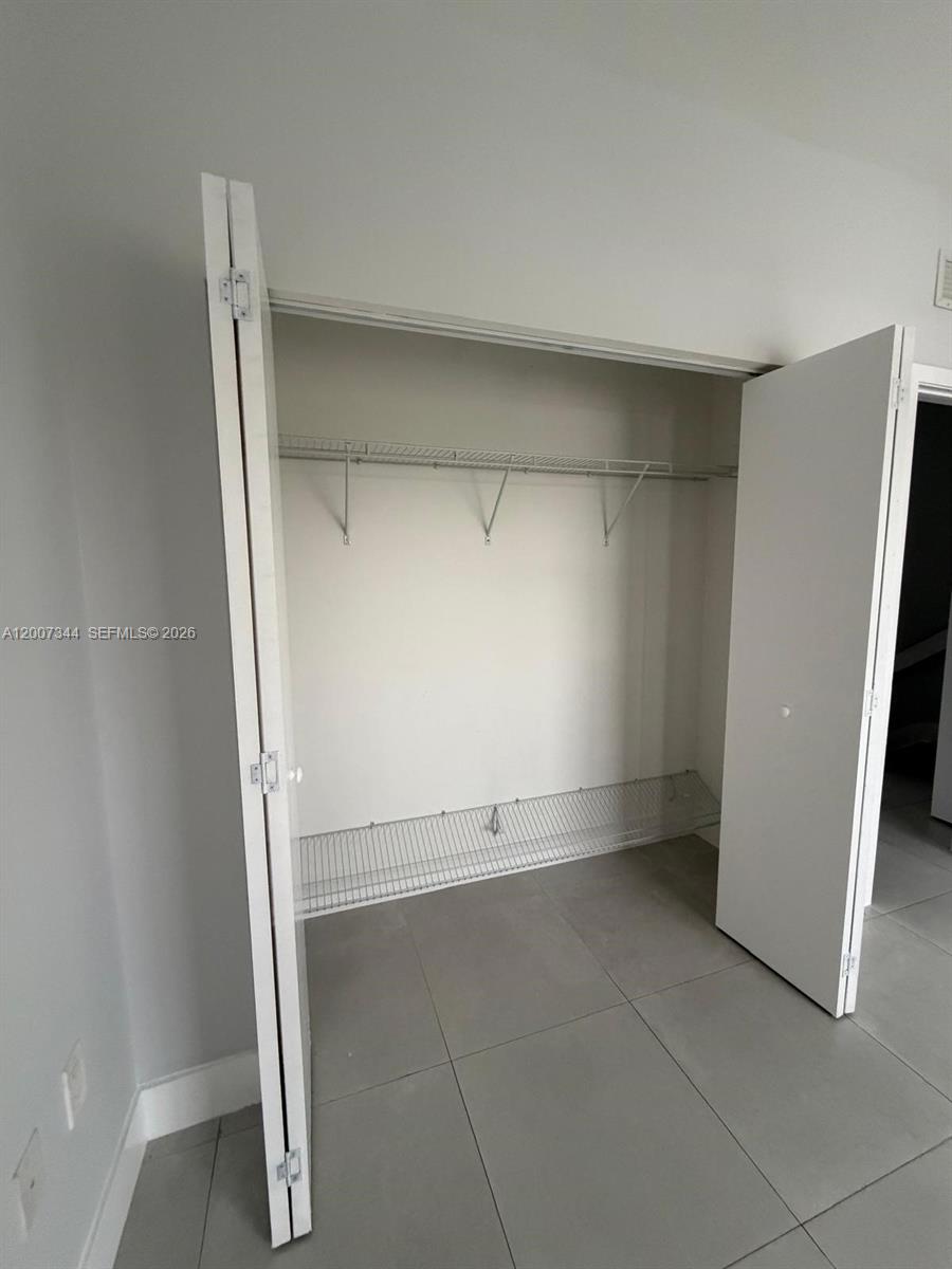 381 East 50th Street, Unit 6 Hialeah, FL 33013 - Photo 33 of 37 an empty room with cabinet