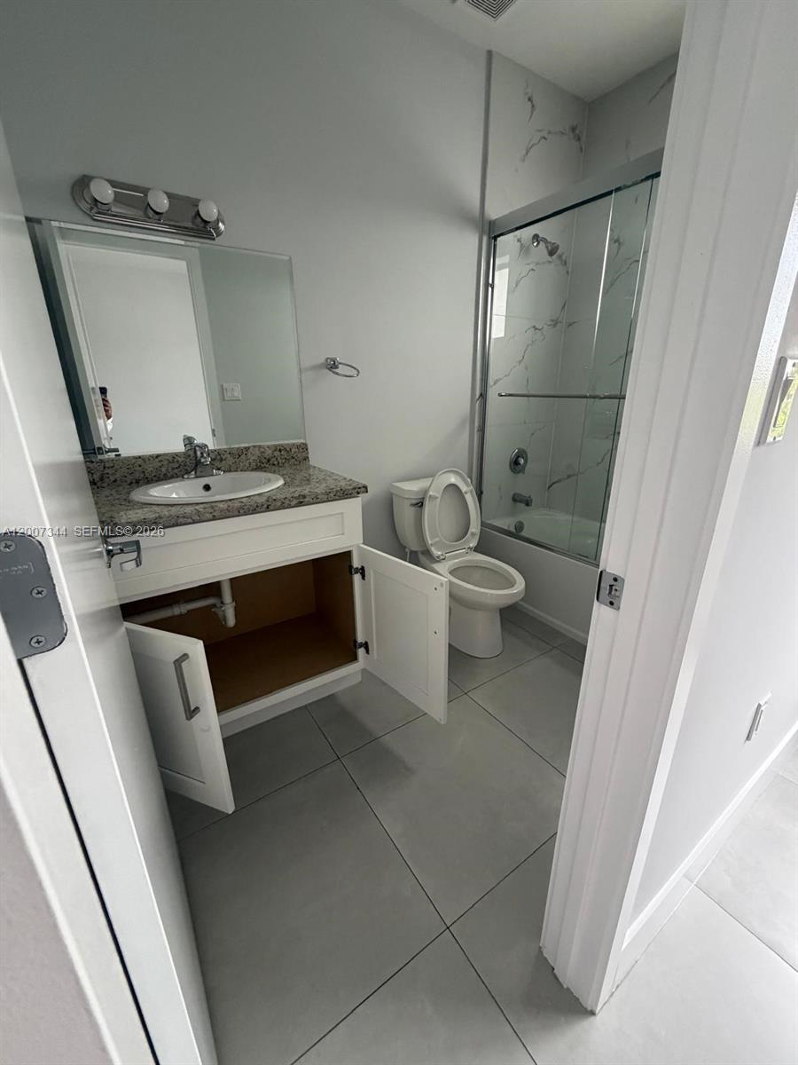 381 East 50th Street, Unit 6 Hialeah, FL 33013 - Photo 34 of 37 a bathroom with a toilet and a sink