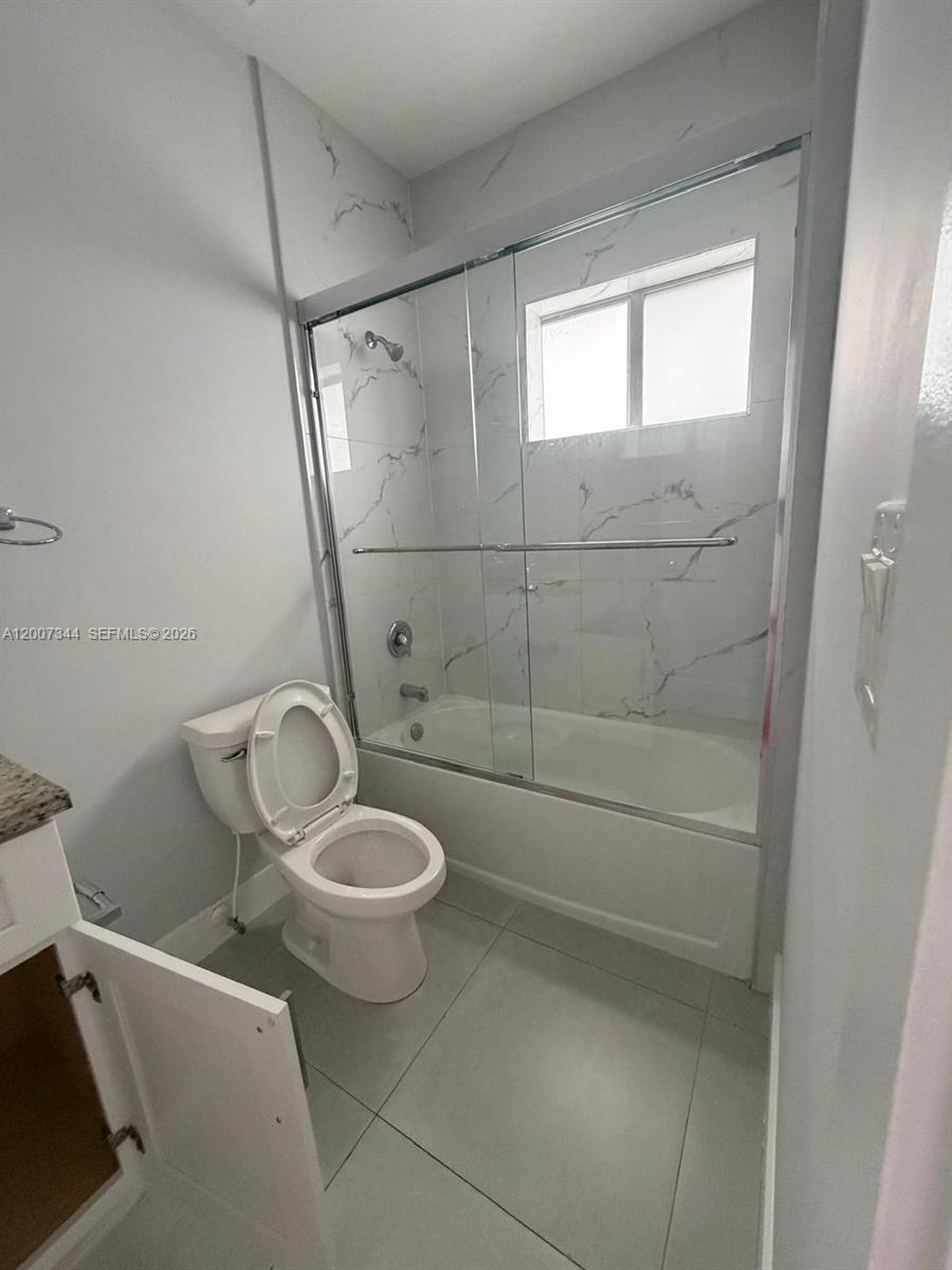 381 East 50th Street, Unit 6 Hialeah, FL 33013 - Photo 35 of 37 a bathroom with a toilet and a shower