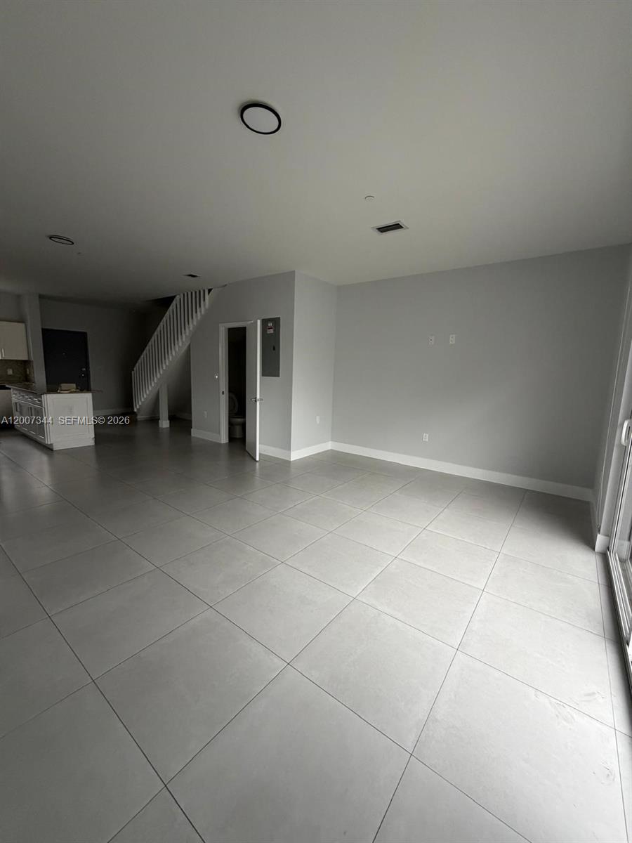 381 East 50th Street, Unit 6 Hialeah, FL 33013 - Photo 10 of 37 a view of an empty room with wooden floor