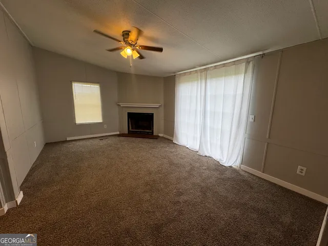 a bedroom with a bed and a mirror