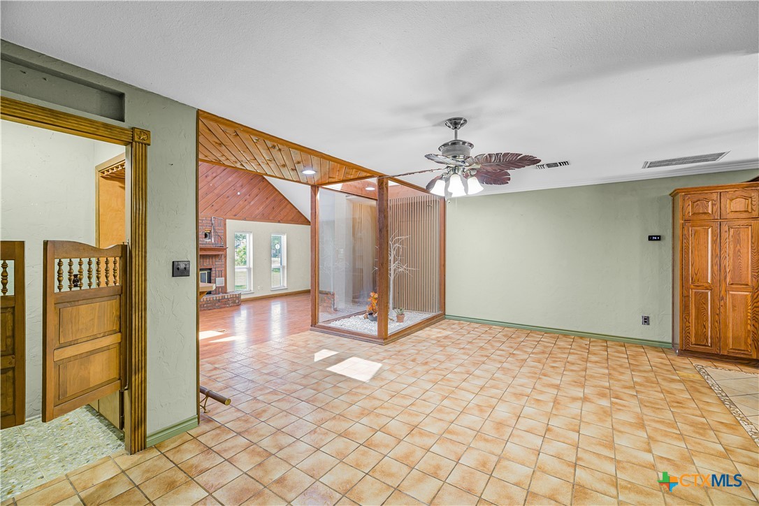 20 Hambleton Road Victoria, TX 77905 - Photo 9 of 48 a view of a hallway with a chandelier