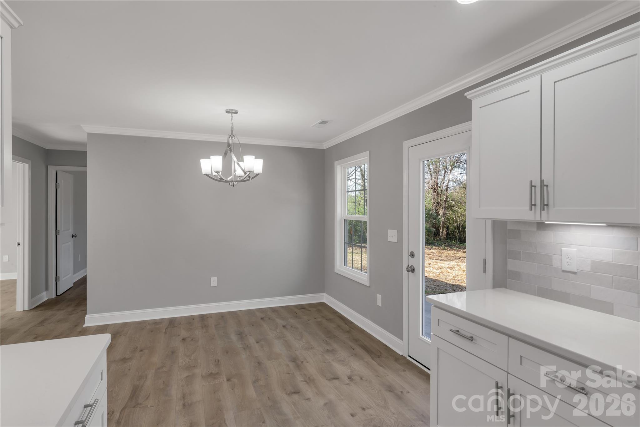 2166 Reeves Road Lancaster, SC 29720 - Photo 14 of 37 wooden floor in an empty room with a window