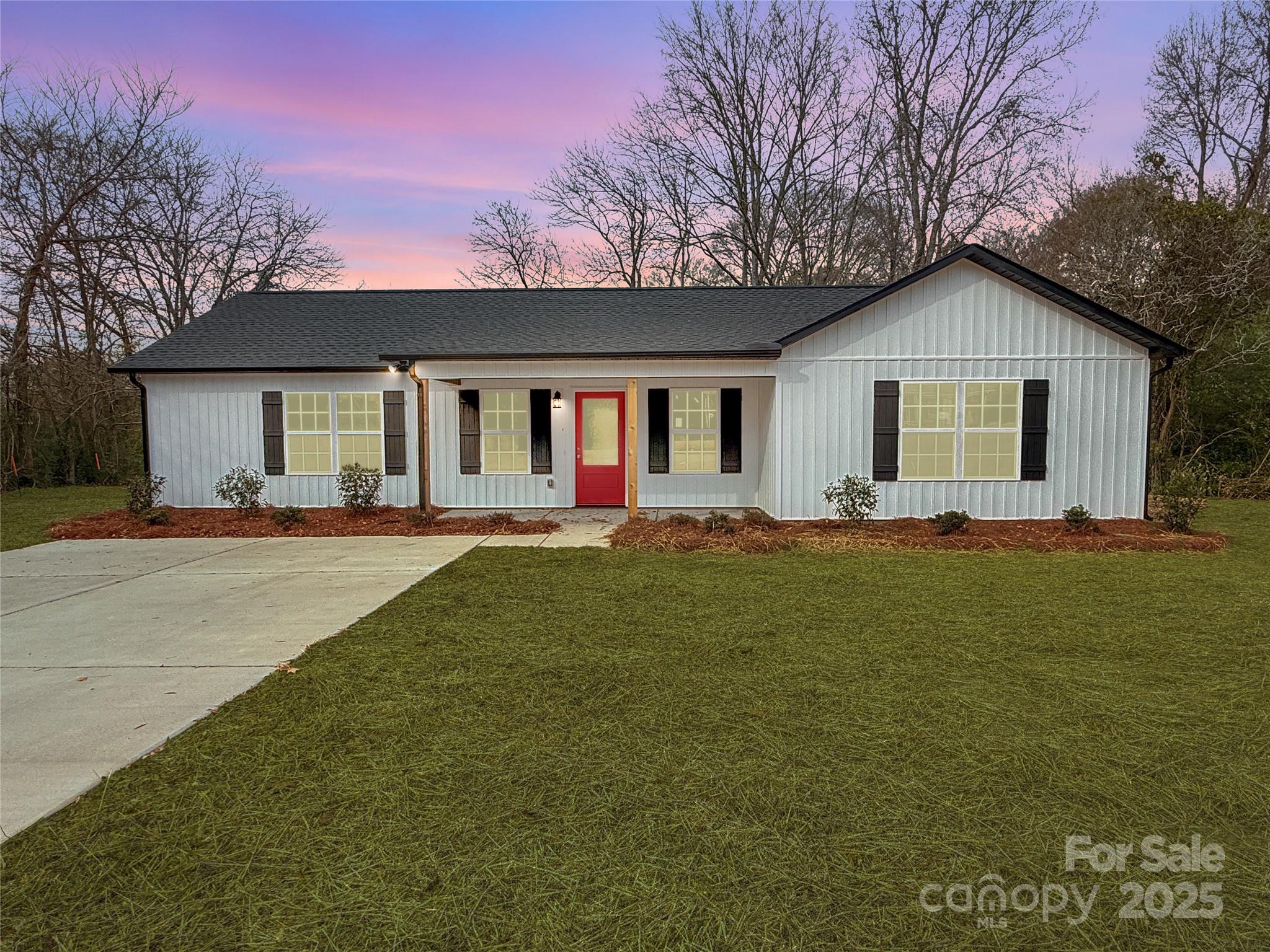 2166 Reeves Road Lancaster, SC 29720 - Photo 2 of 32 a front view of house with yard and trees in the background