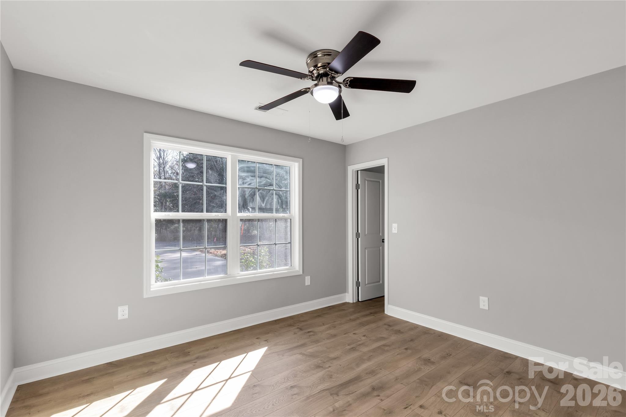 2166 Reeves Road Lancaster, SC 29720 - Photo 21 of 37 a view of empty room with wooden floor and fan