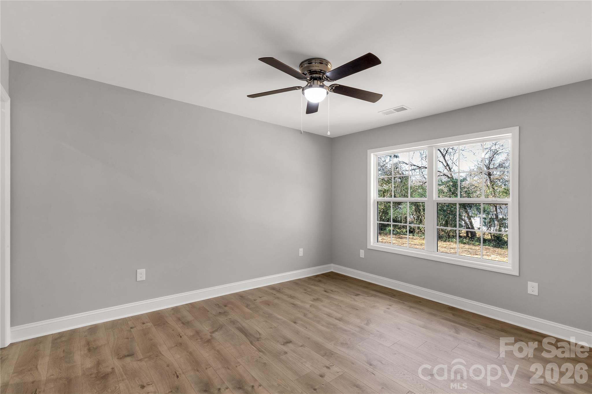 2166 Reeves Road Lancaster, SC 29720 - Photo 25 of 37 a view of a big room with wooden floor and windows in a room