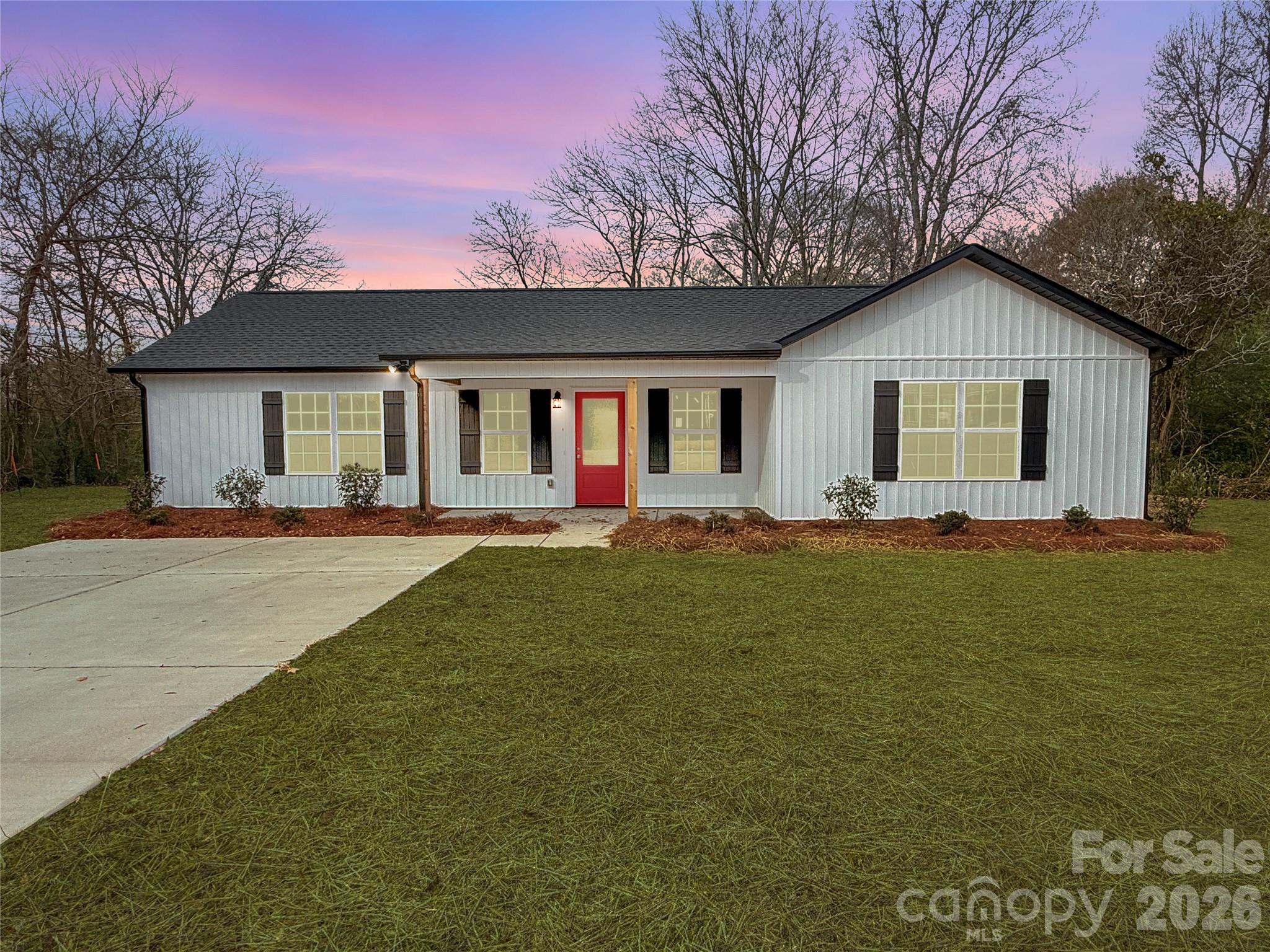 2166 Reeves Road Lancaster, SC 29720 - Photo 3 of 37 a front view of house with yard and trees in the background