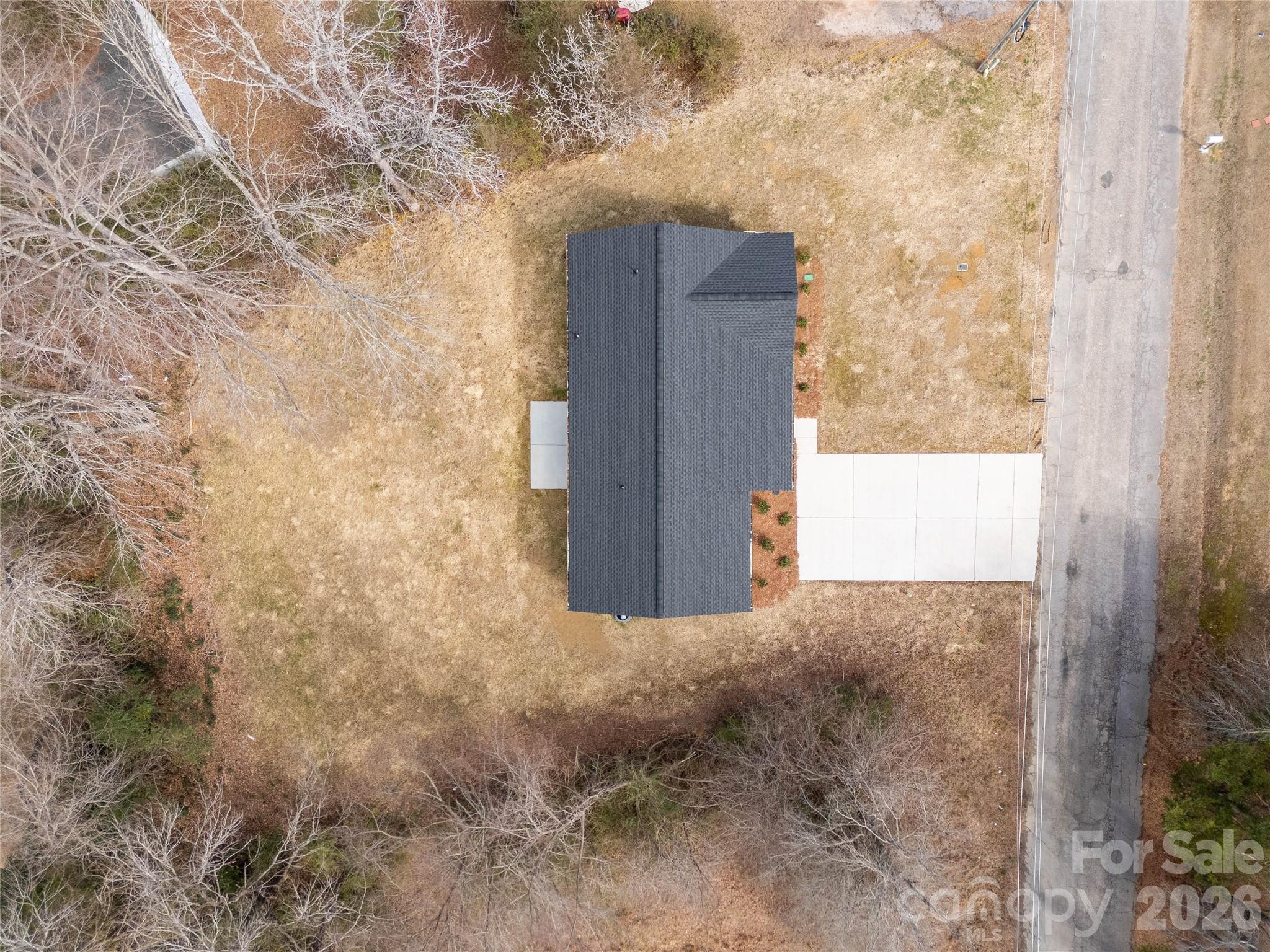 2166 Reeves Road Lancaster, SC 29720 - Photo 37 of 37 a brick building with a yard