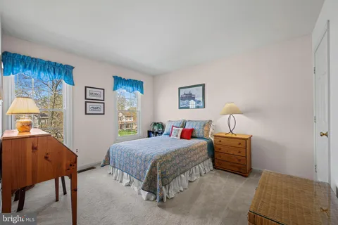 a bedroom with a bed and dresser