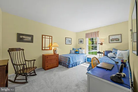 a living room with furniture fireplace and window