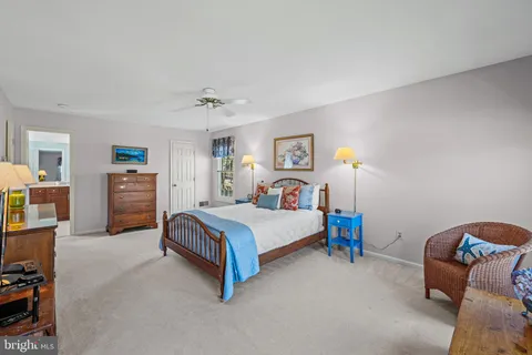 a bedroom with a bed and furniture