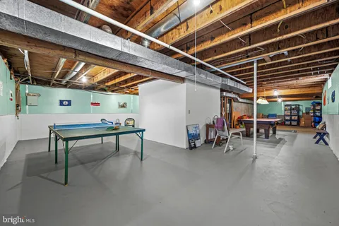 a room with table and a microwave