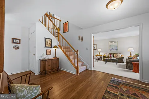 a view of livingroom and dining room with wooden floor