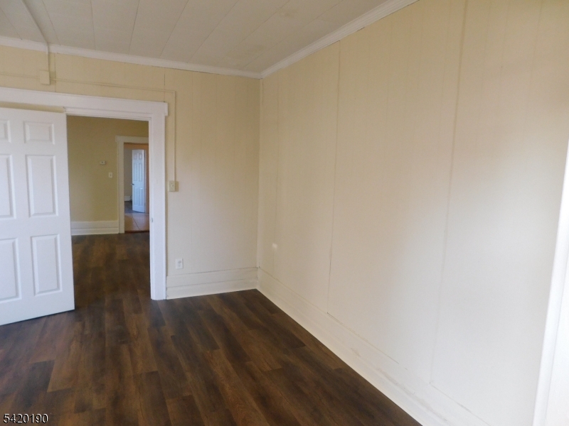 282 Renner Avenue, Unit 1 Newark, NJ 07112 - Photo 12 of 19 a view of a hallway with wooden floor