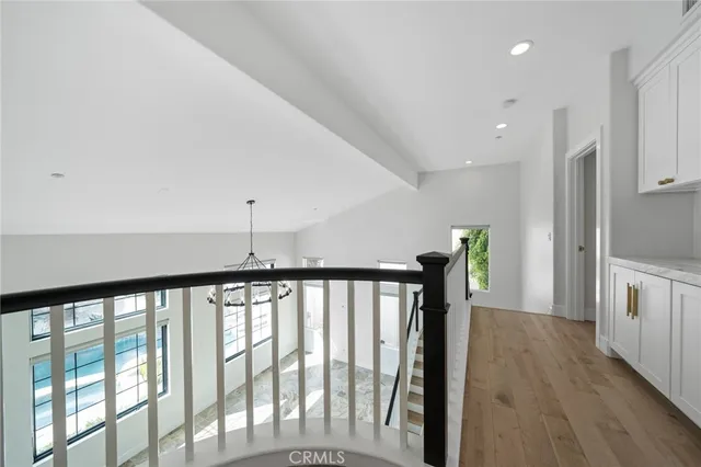 a bathroom with a granite countertop sink toilet and mirror
