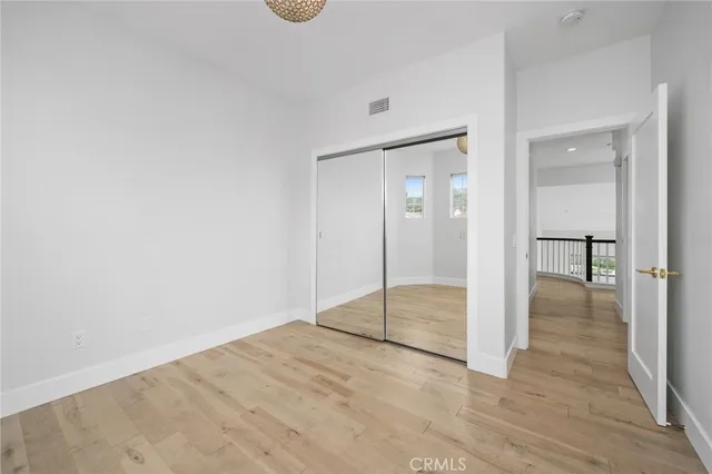 a spacious bathroom with a granite countertop sink mirror and shower
