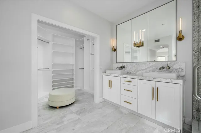 a view of a backyard with plants and patio