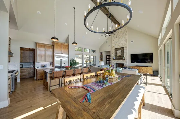 a kitchen with a refrigerator and a stove