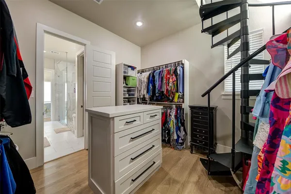 a spacious bathroom with a double vanity sink a mirror and a bathtub