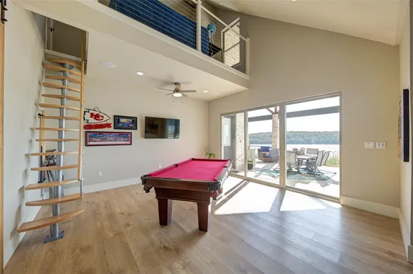 a living room with furniture a fireplace and a table