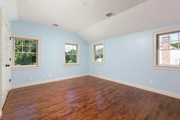 25 Magnolia Road Milton, MA 02186 - Photo 18 of 28 a view of empty room with wooden floor and fan